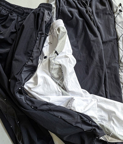 cross string nylon pants
