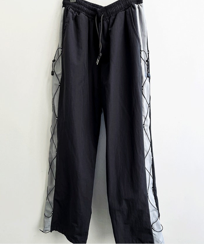 cross string nylon pants